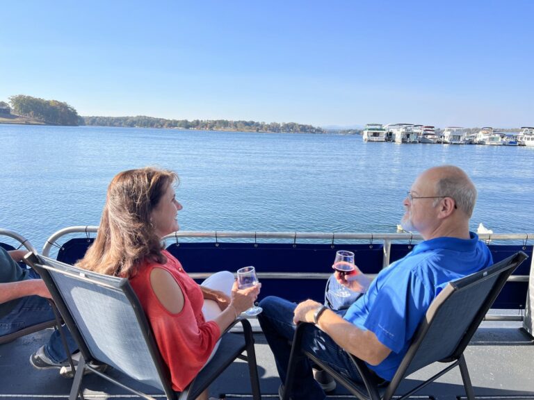 Guests with a glass of wine on the bow