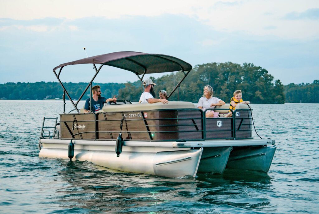 Family on a Keowee Marina tritoon